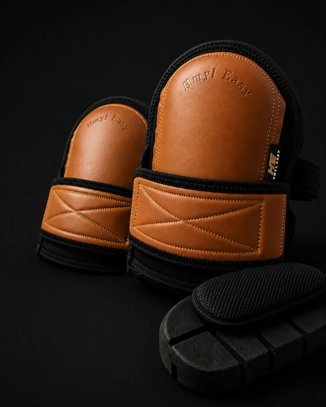 Beige HM-1001 knee pads showing the stitched outer face and wide strap