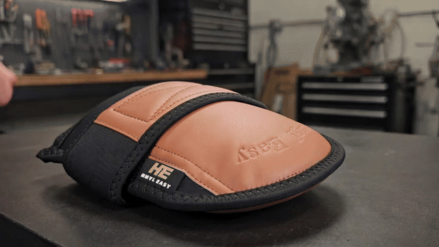 Flooring installer kneeling wearing soft PU synthetic leather strap-on knee pads